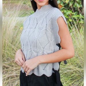 grey cable knit sweater with bow ties